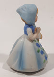 Vintage Girl and Blue and White Floral Dress Wearing a Bonnet and Holding a Basket 4 1/2" Tall Porcelain Figurine