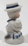 Vintage Brinns Blue and White French Colonial Boy Holding White Puppy Dog 4" Tall Porcelain Figurine