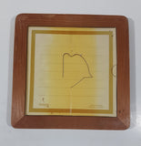 Vintage 1983 Universal Press Syndicate Herman "Dad, I'm writing my life story. Is 'poverty-stricken' one word?" 5 1/2" x 5 1/2" Wood Framed Ceramic Tile Trivet