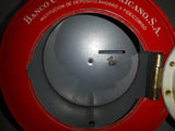 Vintage Banco Comercial Mexicano, S.A. Institucion De Deposito, Ahorro Y Fideicomiso Retro Space Age Cartoon Family and Robot Graphics with Rear Clock Hands 7 1/2" Tall Tin Metal Combination Coin Bank Safe Vault
