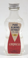 Vintage Empress Pure Almond Extract 2 FL Oz. 4 1/2" Tall Glass Spice Jar Half Full