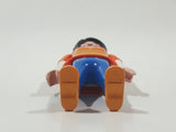 1992 Geobra Playmobil Woman with Black Hair Orange and Yellow Striped Sweater Over White Top and Blue Jean Pants 3" Tall Toy Figure