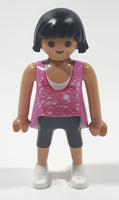 2010 Geobra Playmobil Woman with Black Hair Pink Tank Top and Dark Grey Capri Pants 3" Tall Toy Figure