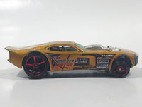 2007 Hot Wheels Nitro Doorslammer Aston Martin Metalflake Gold Die Cast Toy Car Vehicle