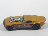 2007 Hot Wheels Nitro Doorslammer Aston Martin Metalflake Gold Die Cast Toy Car Vehicle